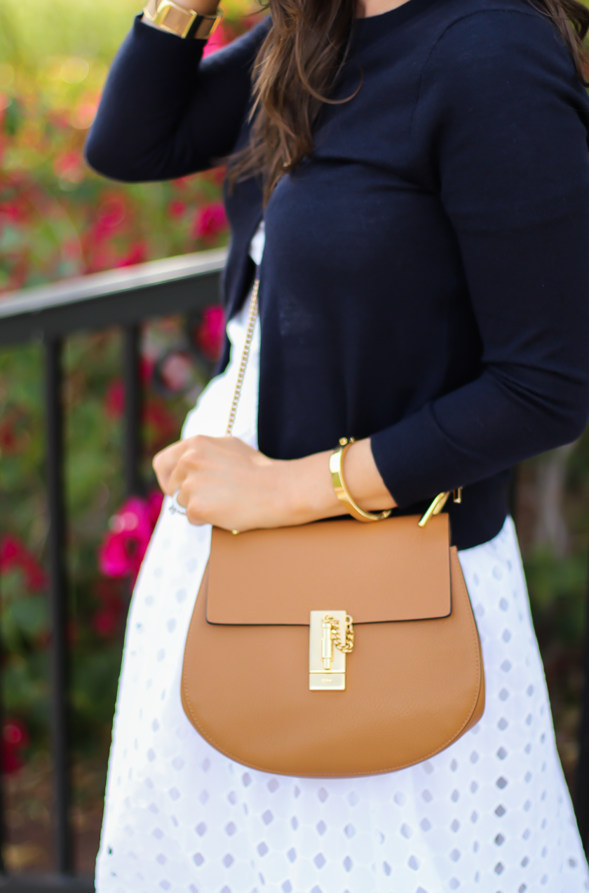 White Eyelet Midi Skirt, Navy Cardigan, Tan Wedge Sandals, Tan Chain Strap Crossobdy Bag, Revolve Clothing, J.Crew, Chloe, Seychelles 17