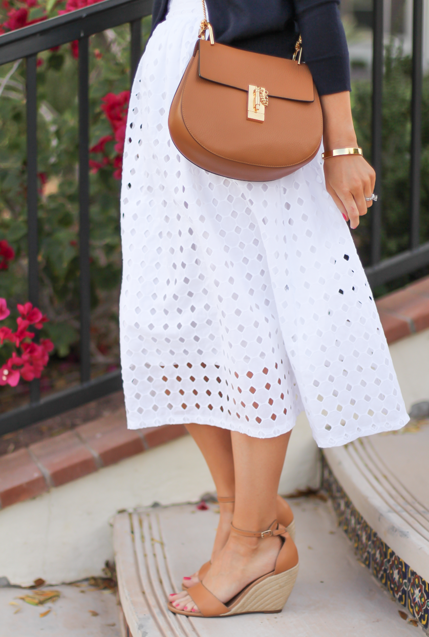 White Eyelet Midi Skirt, Navy Cardigan, Tan Wedge Sandals, Tan Chain Strap Crossobdy Bag, Revolve Clothing, J.Crew, Chloe, Seychelles 19