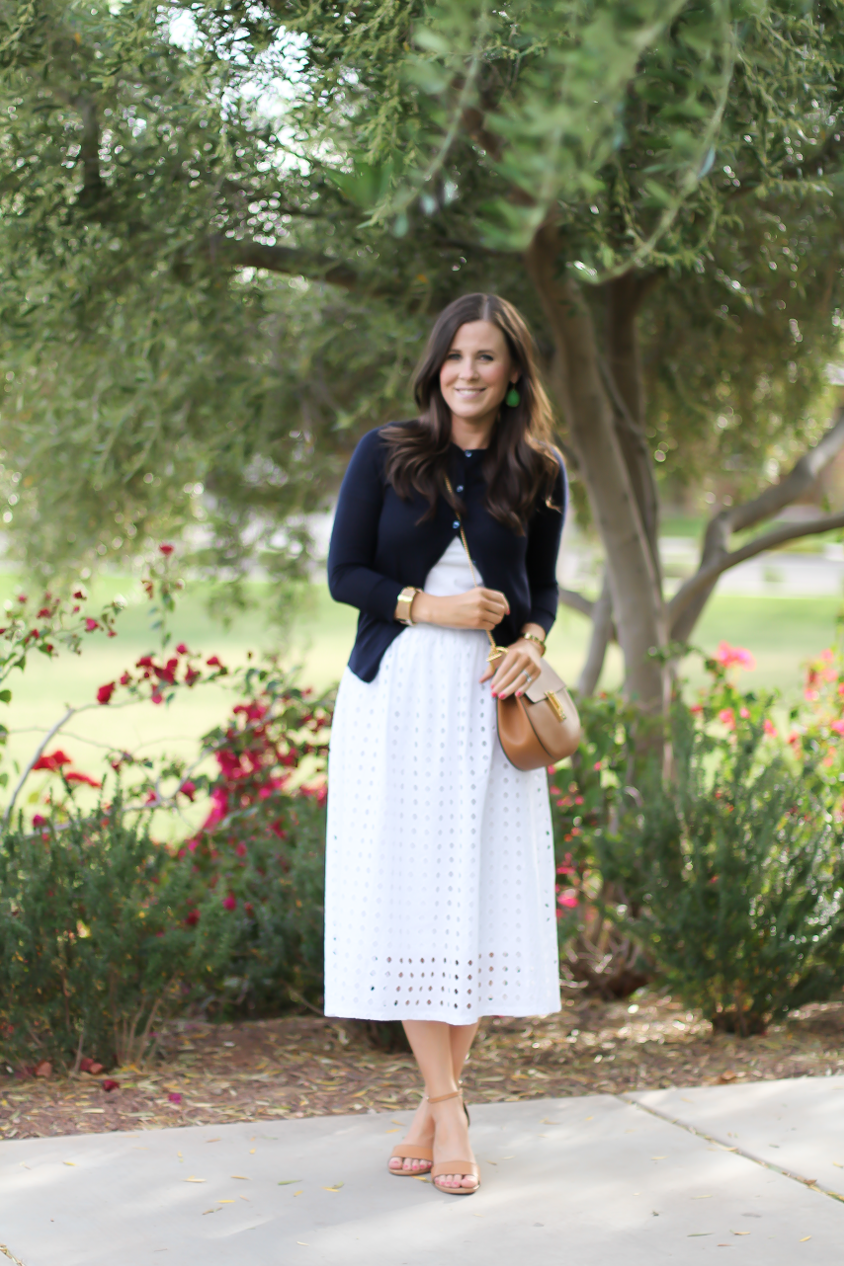 White Eyelet Midi Skirt, Navy Cardigan, Tan Wedge Sandals, Tan Chain Strap Crossobdy Bag, Revolve Clothing, J.Crew, Chloe, Seychelles