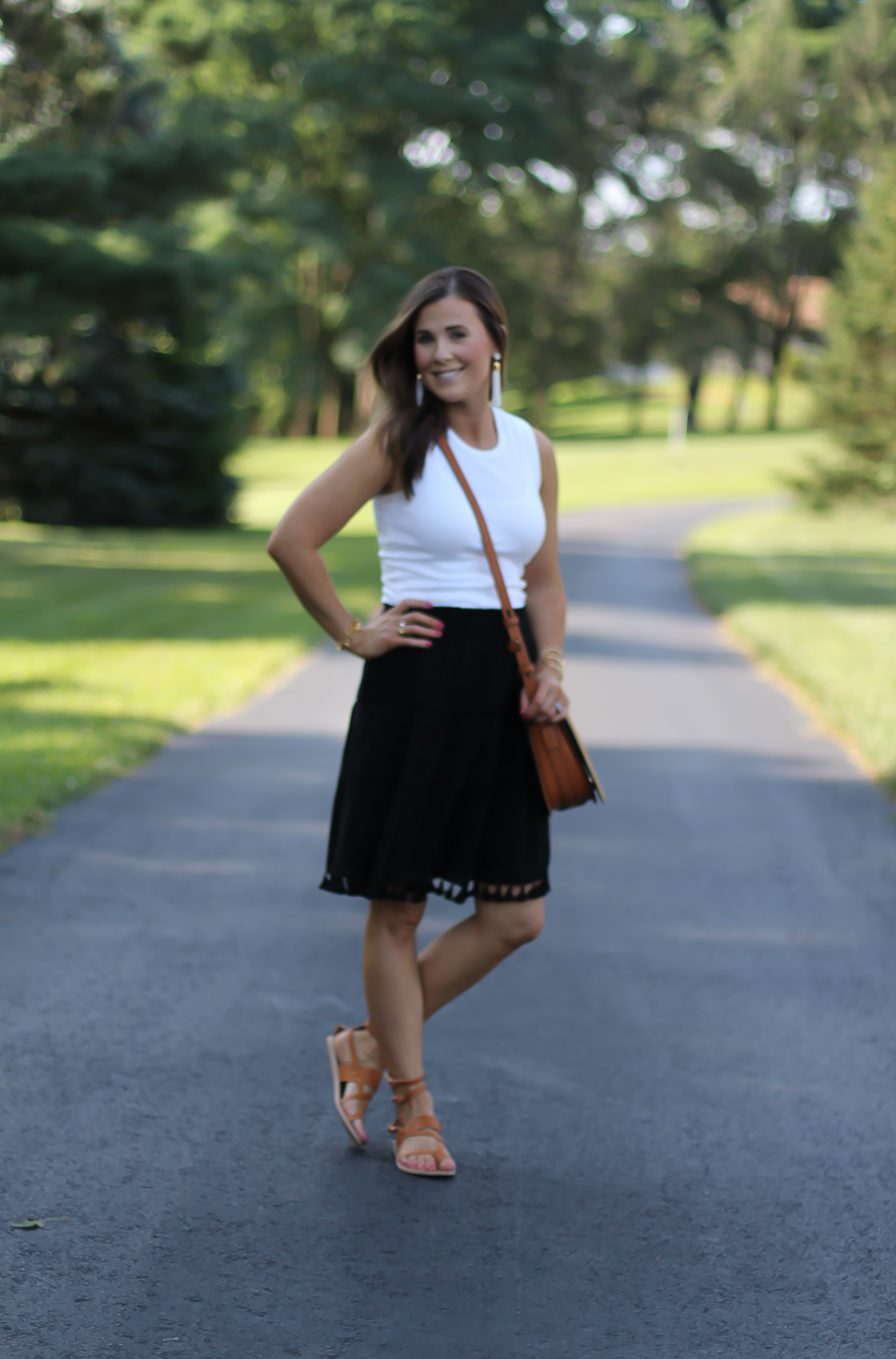 Black Tassel Skirt, White Sleeveless Tee, Tan Gladiator Sandals, White Tassel Earrings, Tan Saddlebag, Loft, J.Crew, Tory Burch, Ancient Gladiator 10