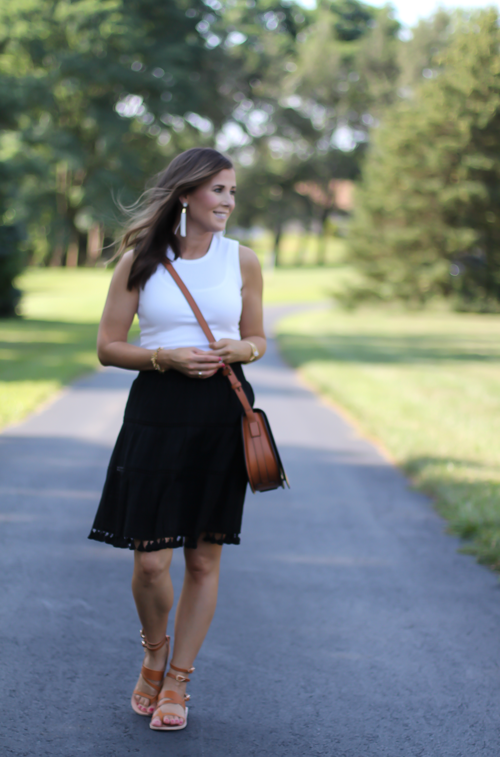 Black Tassel Skirt, White Sleeveless Tee, Tan Gladiator Sandals, White Tassel Earrings, Tan Saddlebag, Loft, J.Crew, Tory Burch, Ancient Gladiator 7