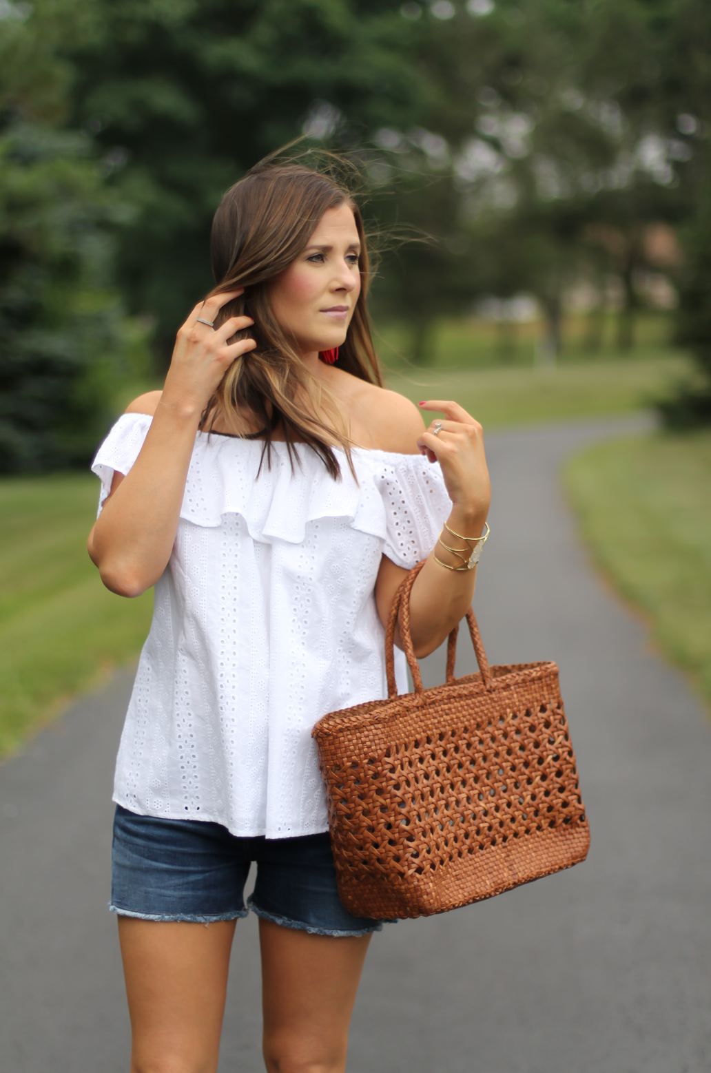 White Eyelet Off the Shoulder Blouse, Dark Rinse Cutoff Denim Shorts, Tan Leather Wedge Sandal, Leather Basket Tote, Red Tassel Earrings, Anthropologie, Citizens of Humanity, Madewell, J.Crew, Lisi Lerch 7